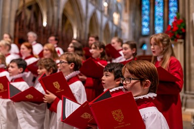 Boy and girl choristers singing